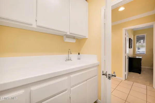 a bathroom with a bathtub and a window