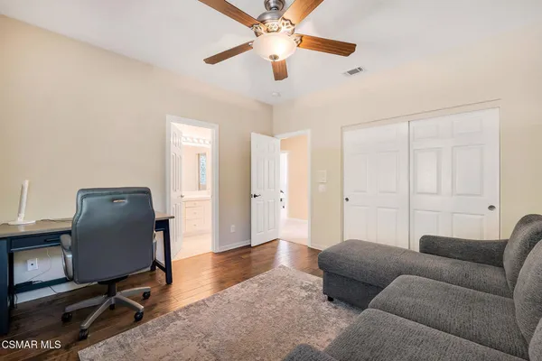 a bedroom with a bed and a cabinets