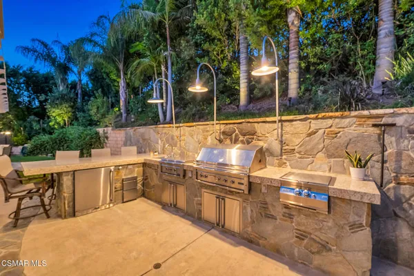 a view of a chairs and table in the patio