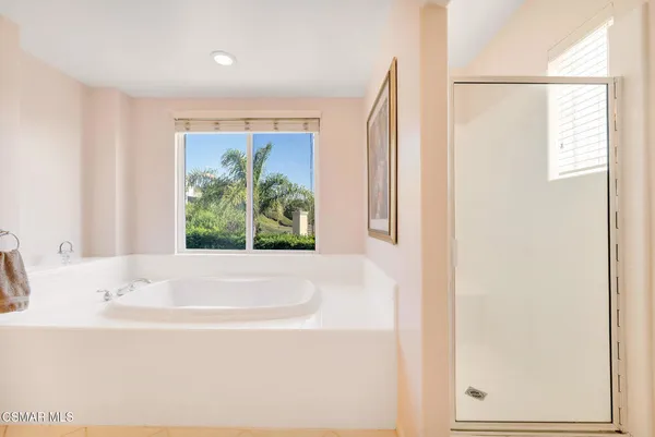 a view of a patio with a table chairs and a backyard