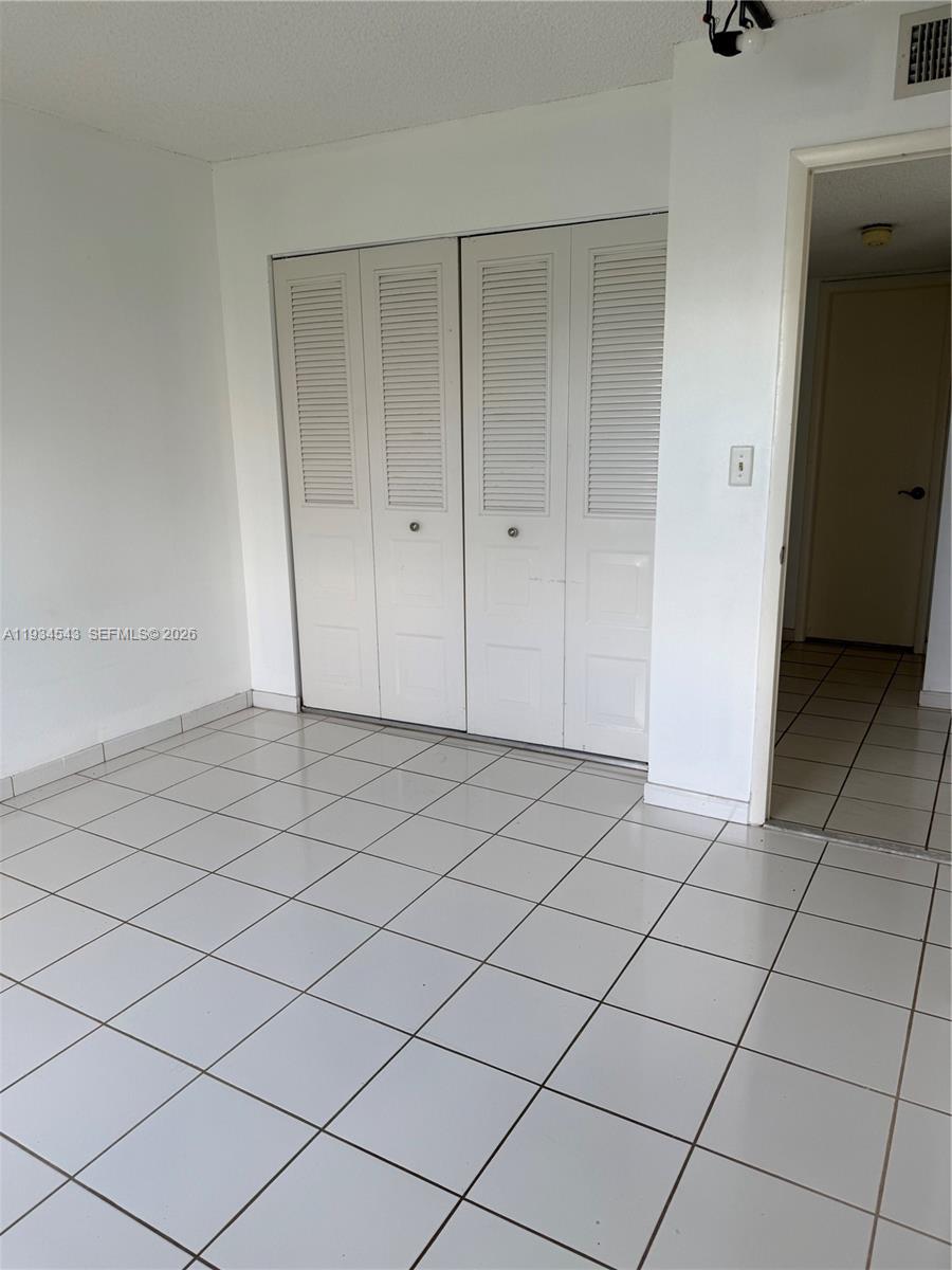 5199 Northwest 7th Street, Unit 115 Miami, FL 33126 - Photo 14 of 14 a view of a garage