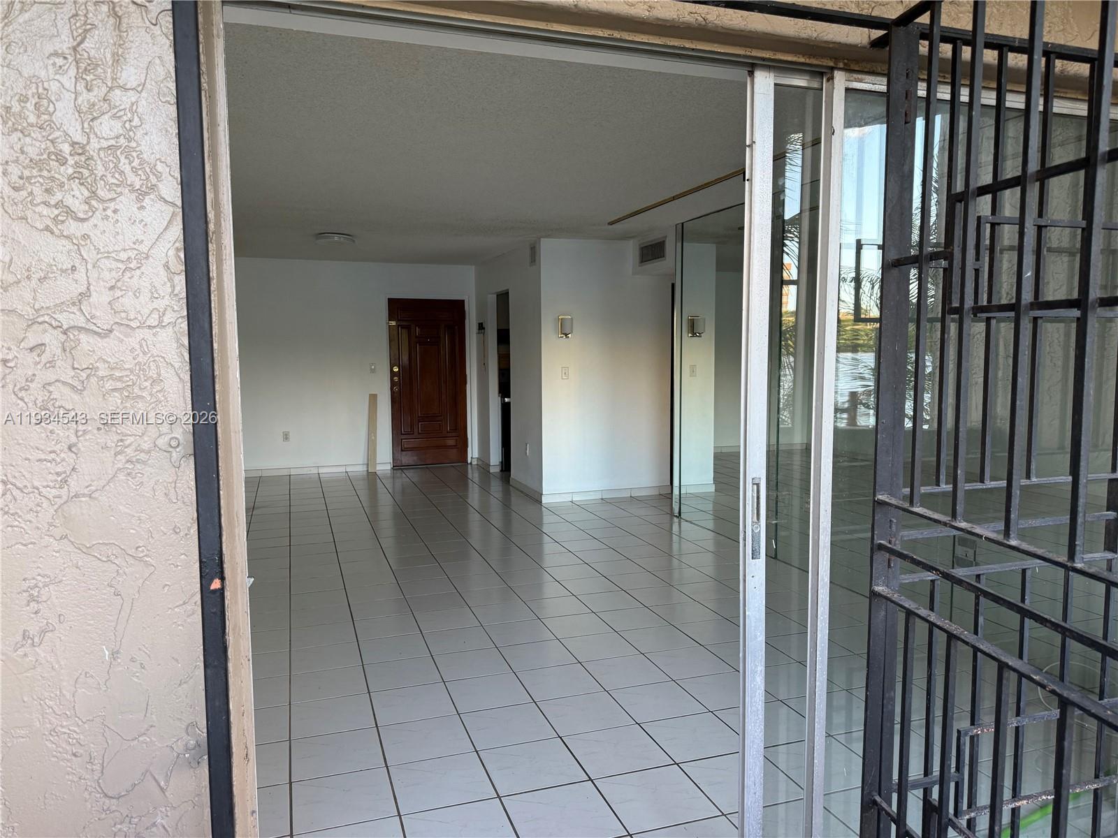 5199 Northwest 7th Street, Unit 115 Miami, FL 33126 - Photo 8 of 14 a view of a hallway