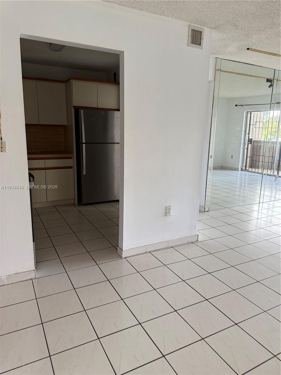 5199 Northwest 7th Street, Unit 115 Miami, FL 33126 - Photo 10 of 14 a view of empty room