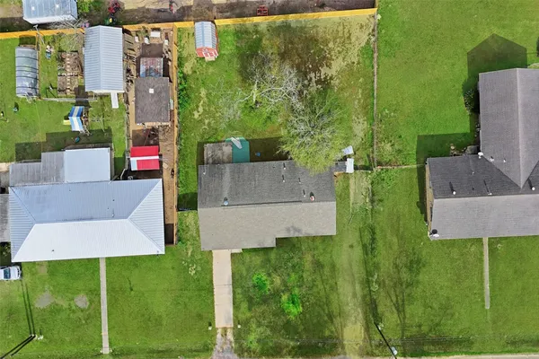 an aerial view of house with yard