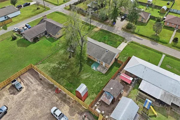 an aerial view of house with yard