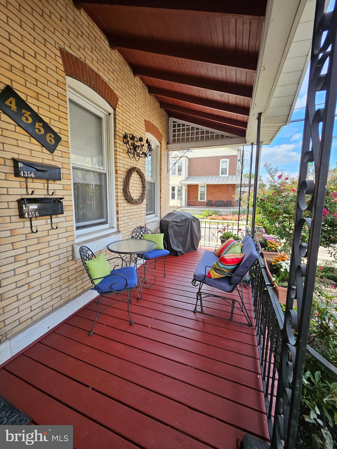 a view of a deck with wooden floor and furniture