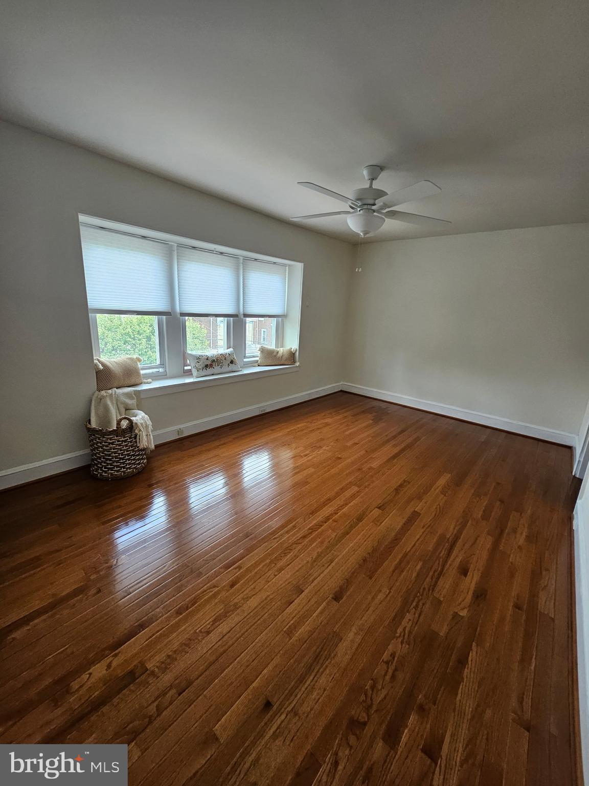4356 Manayunk Avenue, Unit 2 Philadelphia, PA 19128 - Photo 28 of 43 an empty room with wooden floor and windows