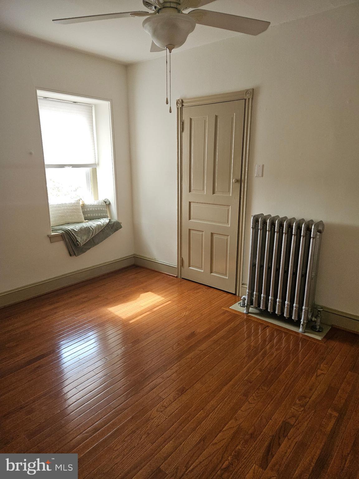 4356 Manayunk Avenue, Unit 2 Philadelphia, PA 19128 - Photo 3 of 43 an empty room with wooden floor and windows