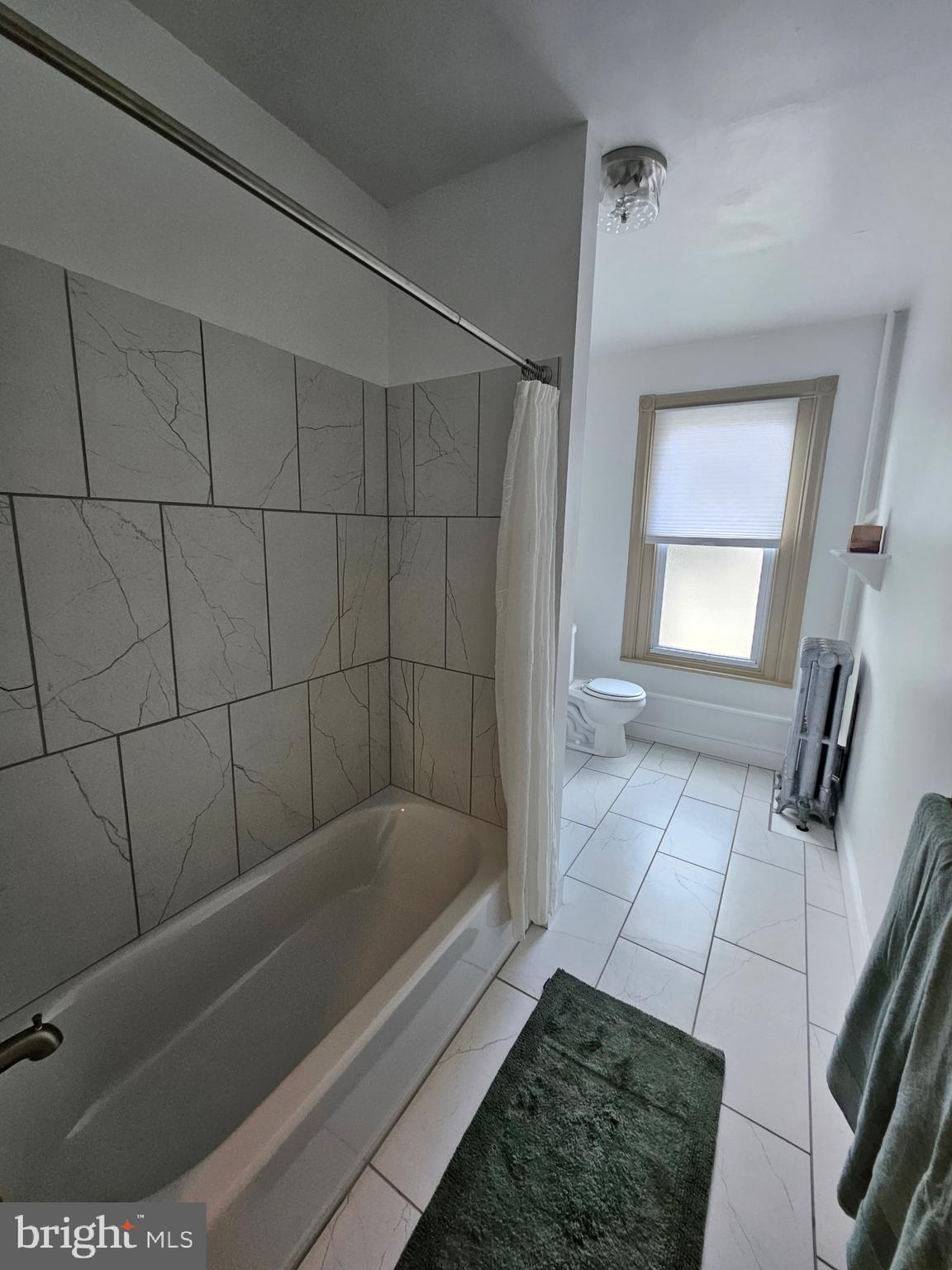 4356 Manayunk Avenue, Unit 2 Philadelphia, PA 19128 - Photo 39 of 43 a bathroom with a bathtub
