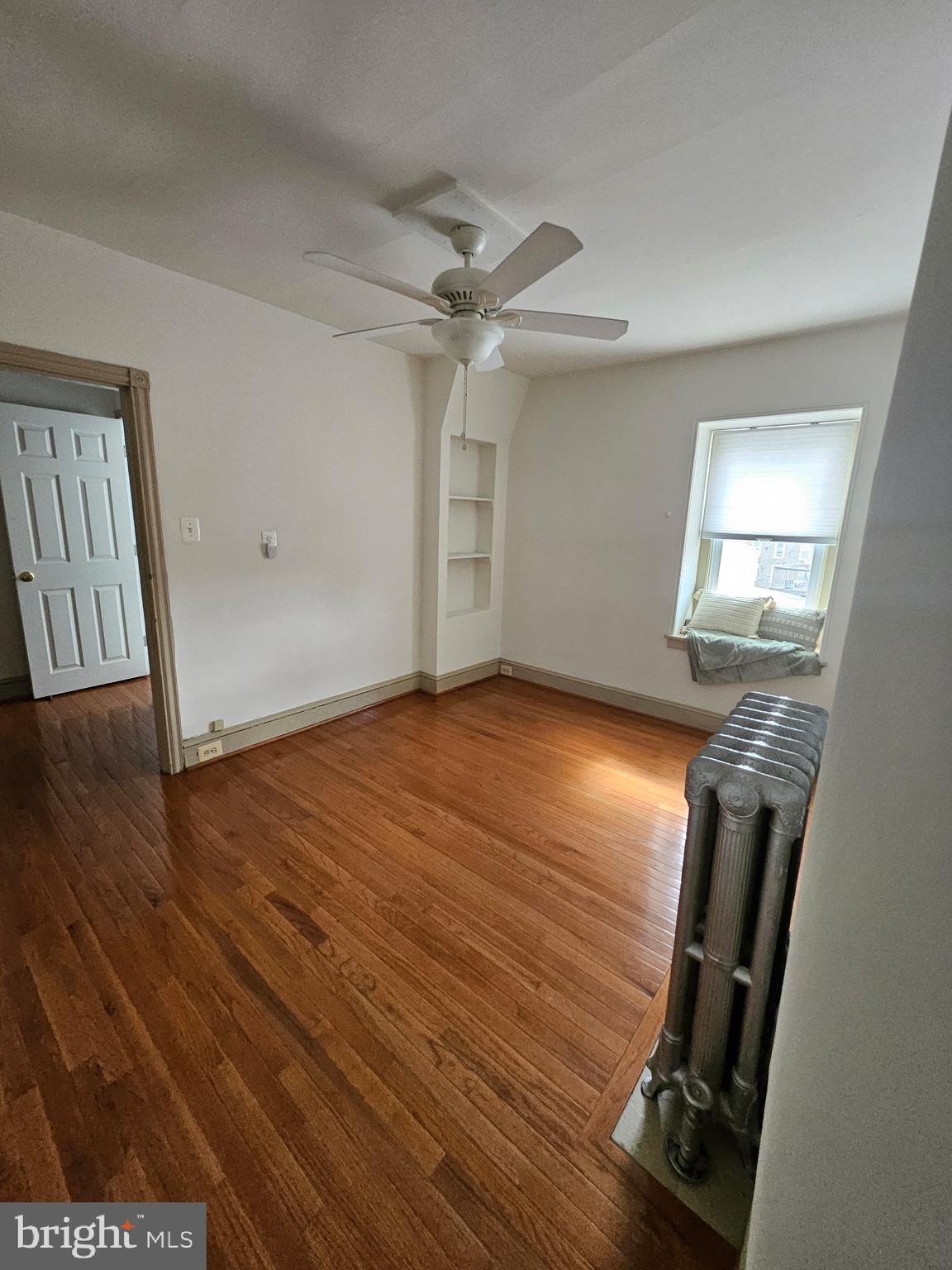 4356 Manayunk Avenue, Unit 2 Philadelphia, PA 19128 - Photo 41 of 43 wooden floor in an empty room with a window