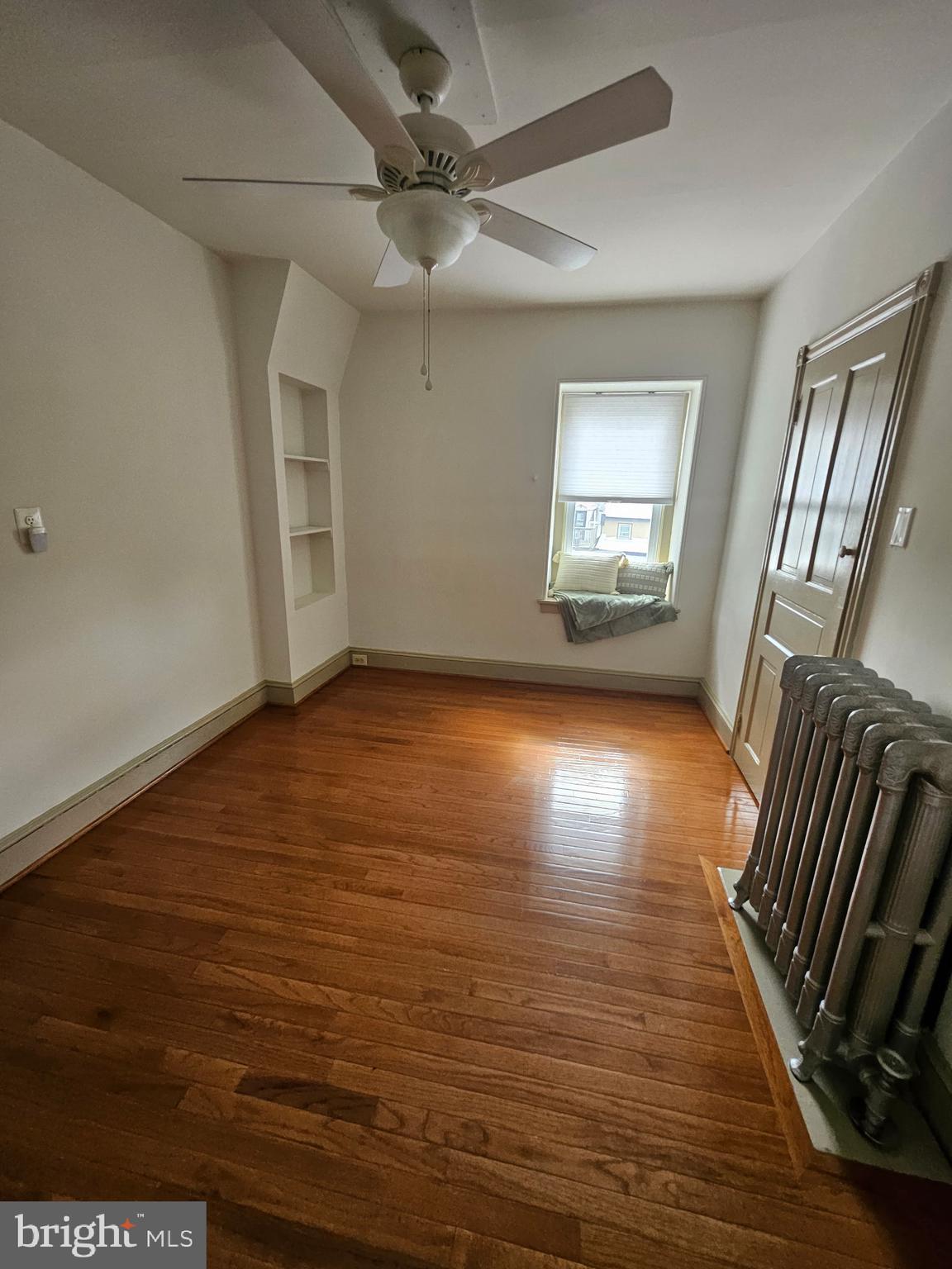 4356 Manayunk Avenue, Unit 2 Philadelphia, PA 19128 - Photo 42 of 43 wooden floor in an empty room with a window