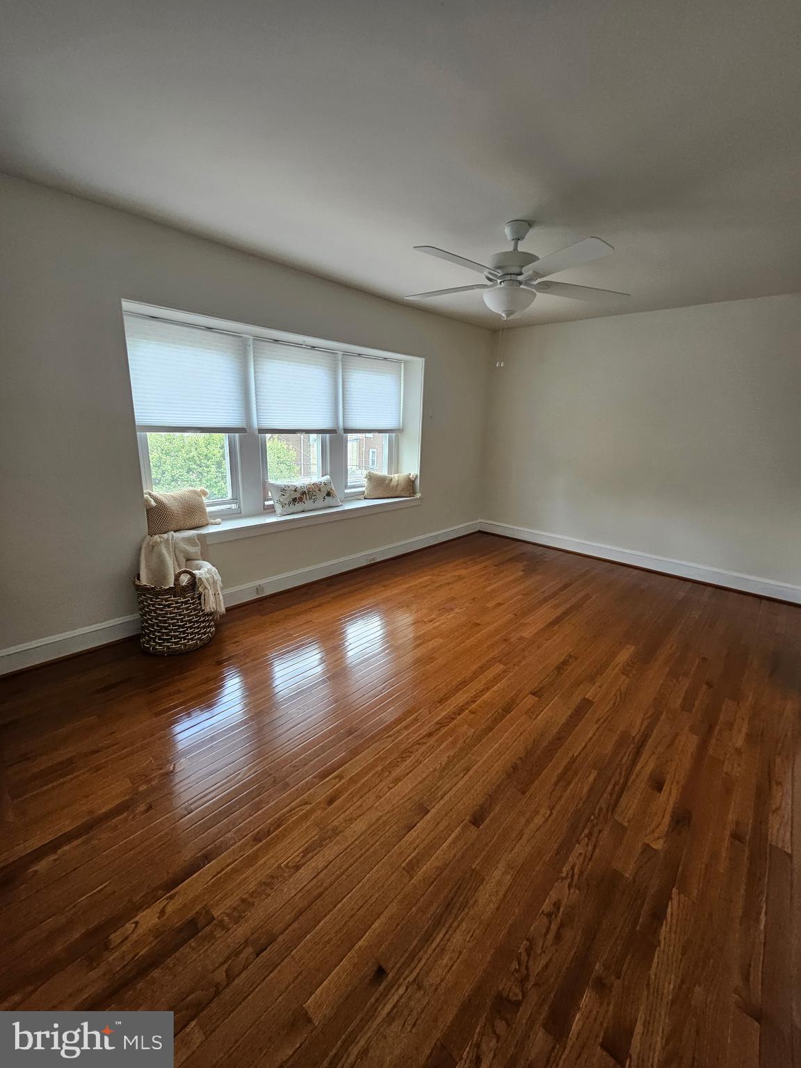 4356 Manayunk Avenue, Unit 2 Philadelphia, PA 19128 - Photo 7 of 43 an empty room with wooden floor chandelier and windows