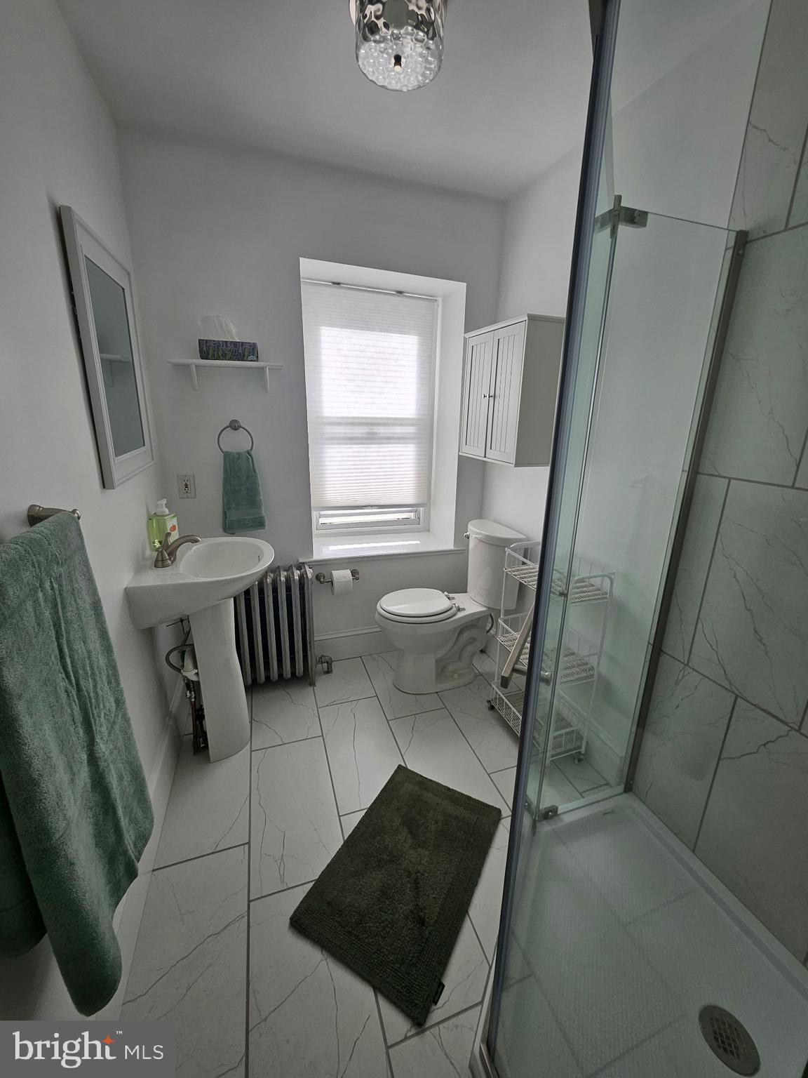 4356 Manayunk Avenue, Unit 2 Philadelphia, PA 19128 - Photo 9 of 43 a living room with furniture and a window