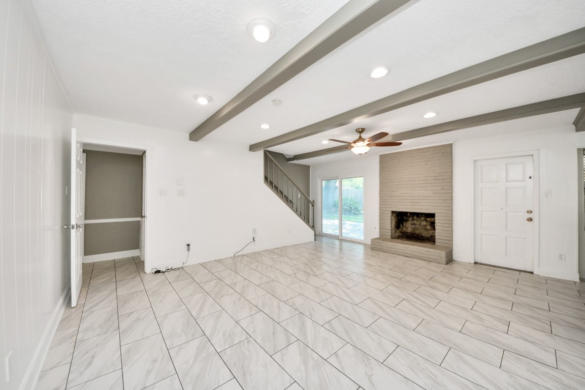 8119 Concho Street Houston, TX 77036 - Photo 11 of 35 With a fireplace in the living room, this is sure to bring together friends and family!