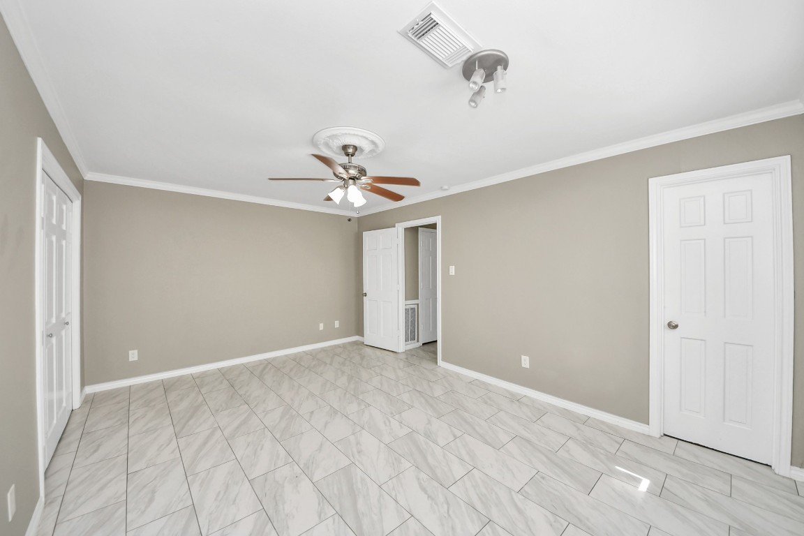 8119 Concho Street Houston, TX 77036 - Photo 13 of 35 Stretching out at 17 foot long, this primary bedroom has great flexibility!