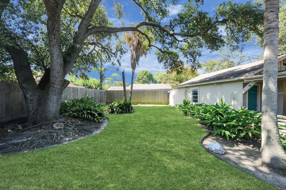 8119 Concho Street Houston, TX 77036 - Photo 27 of 35 Not only is the back yard beautiful in green but there is also tons of room to enjoy!