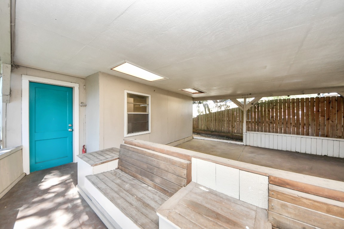 8119 Concho Street Houston, TX 77036 - Photo 32 of 35 Step through the gorgeous blue door out back to additional living space.