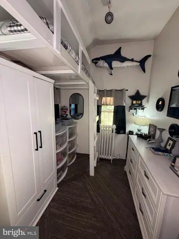 a kitchen with stainless steel appliances a stove a refrigerator and a cabinets