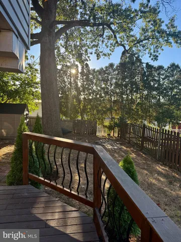 a balcony with wooden floor