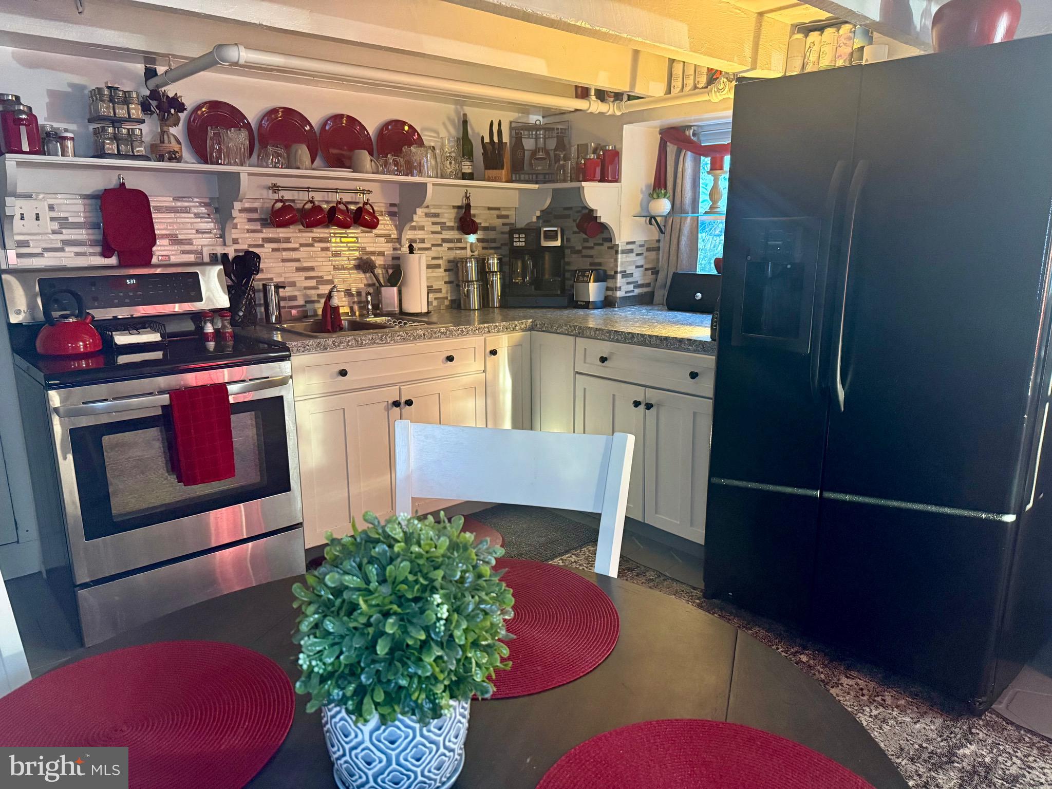 3124 Gray Street Reading, PA 19605 - Photo 7 of 13 a view of kitchen with stainless steel appliances granite countertop cabinets and a couch