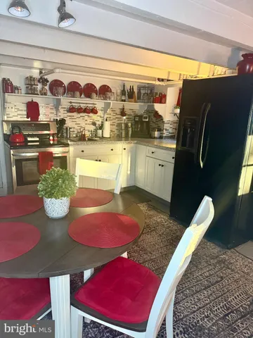 a view of a dining room with furniture