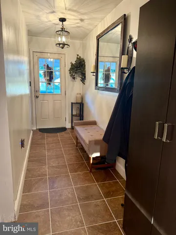 a living room with a black white checkered floor