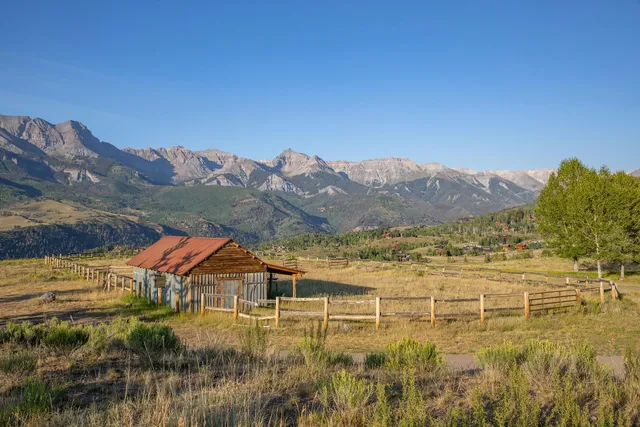 a view of houses with a lake and mountain view