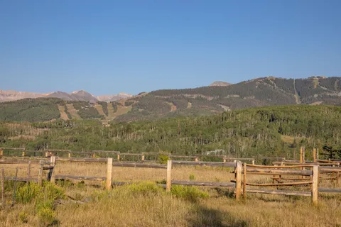 a view of a town with mountains in the background
