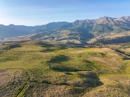 a view of an ocean and a mountain
