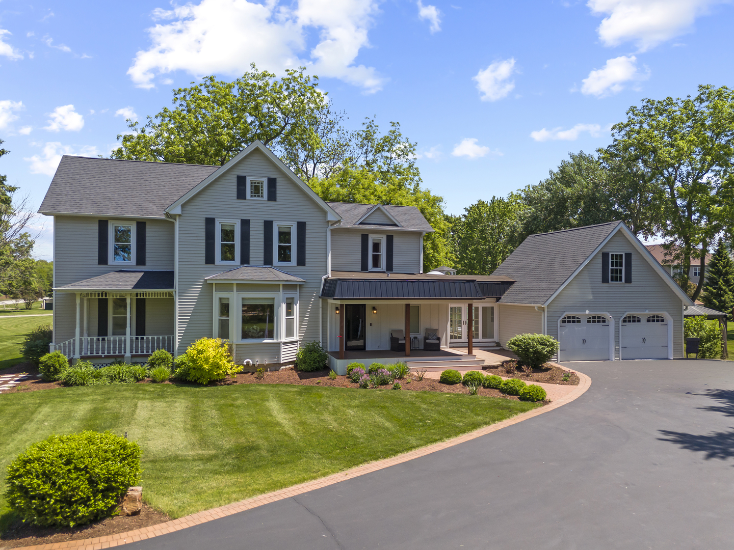 3614 Wolf Road Oswego, IL 60543 - Photo 1 of 56 a front view of a house with garden and trees