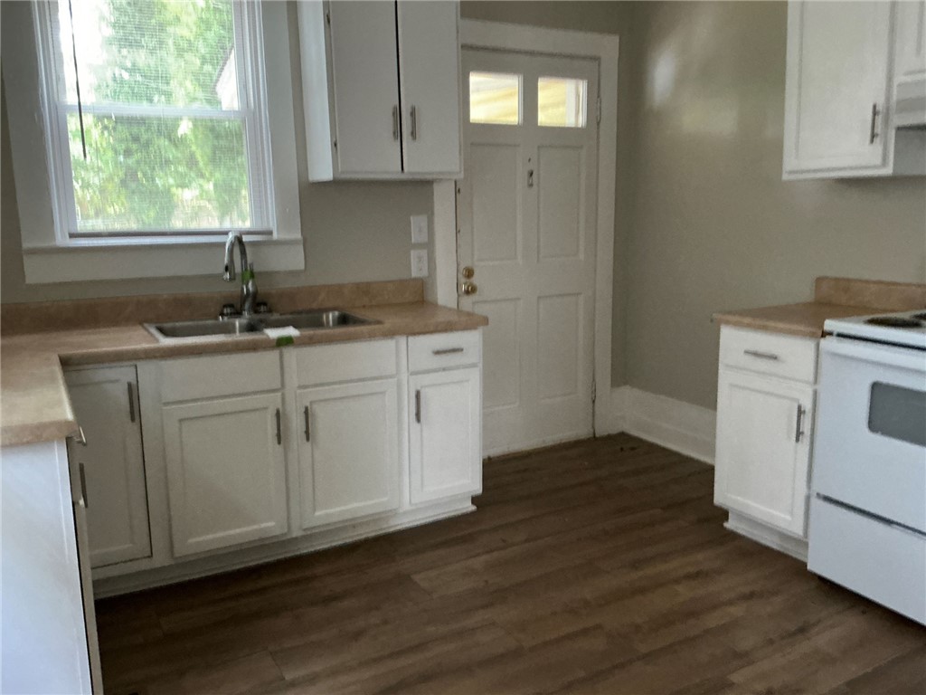 504 Caughlin Avenue Anderson, SC 29624 - Photo 6 of 15 A well-appointed kitchen features ample cabinetry, a double sink, and sleek appliances, perfect for everyday living.