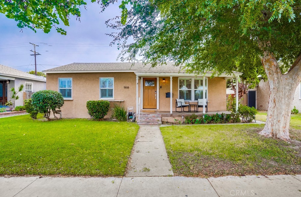 1908 Clark Avenue Long Beach, CA 90815 - Photo 1 of 1 a front view of a house with a garden