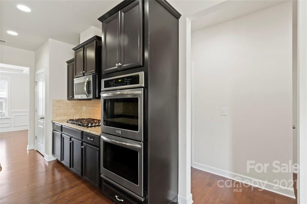 4331 Oxford Mill Road Waxhaw, NC 28173 - Photo 13 of 48 a kitchen with stainless steel appliances a stove and a refrigerator