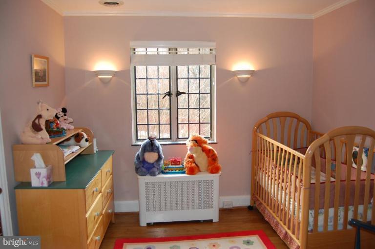 101 Overhill Road Baltimore, MD 21210 - Photo 11 of 24 a bedroom with furniture and a window
