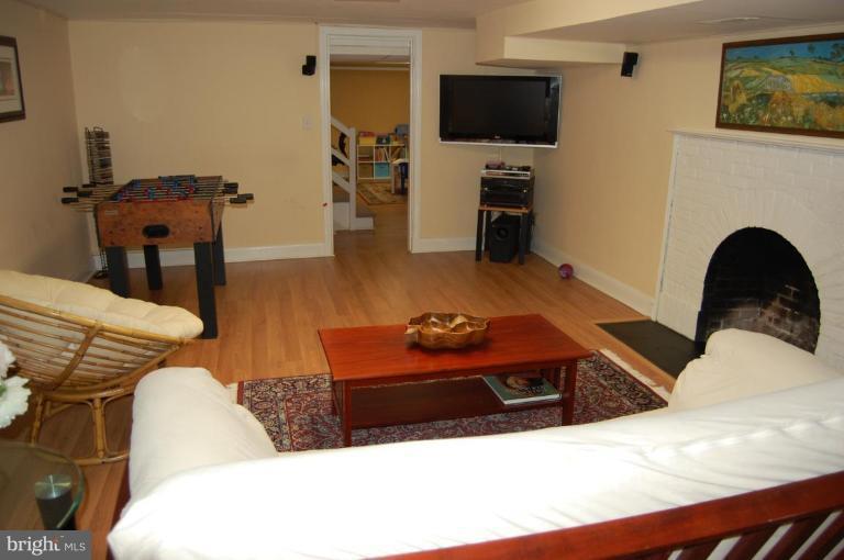 101 Overhill Road Baltimore, MD 21210 - Photo 17 of 24 a living room with furniture and a flat screen tv