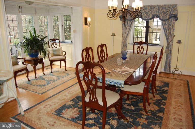 101 Overhill Road Baltimore, MD 21210 - Photo 24 of 24 a view of a dining room with furniture a chandelier and wooden floor