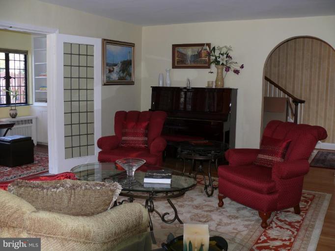 101 Overhill Road Baltimore, MD 21210 - Photo 4 of 24 a living room with furniture and a fireplace