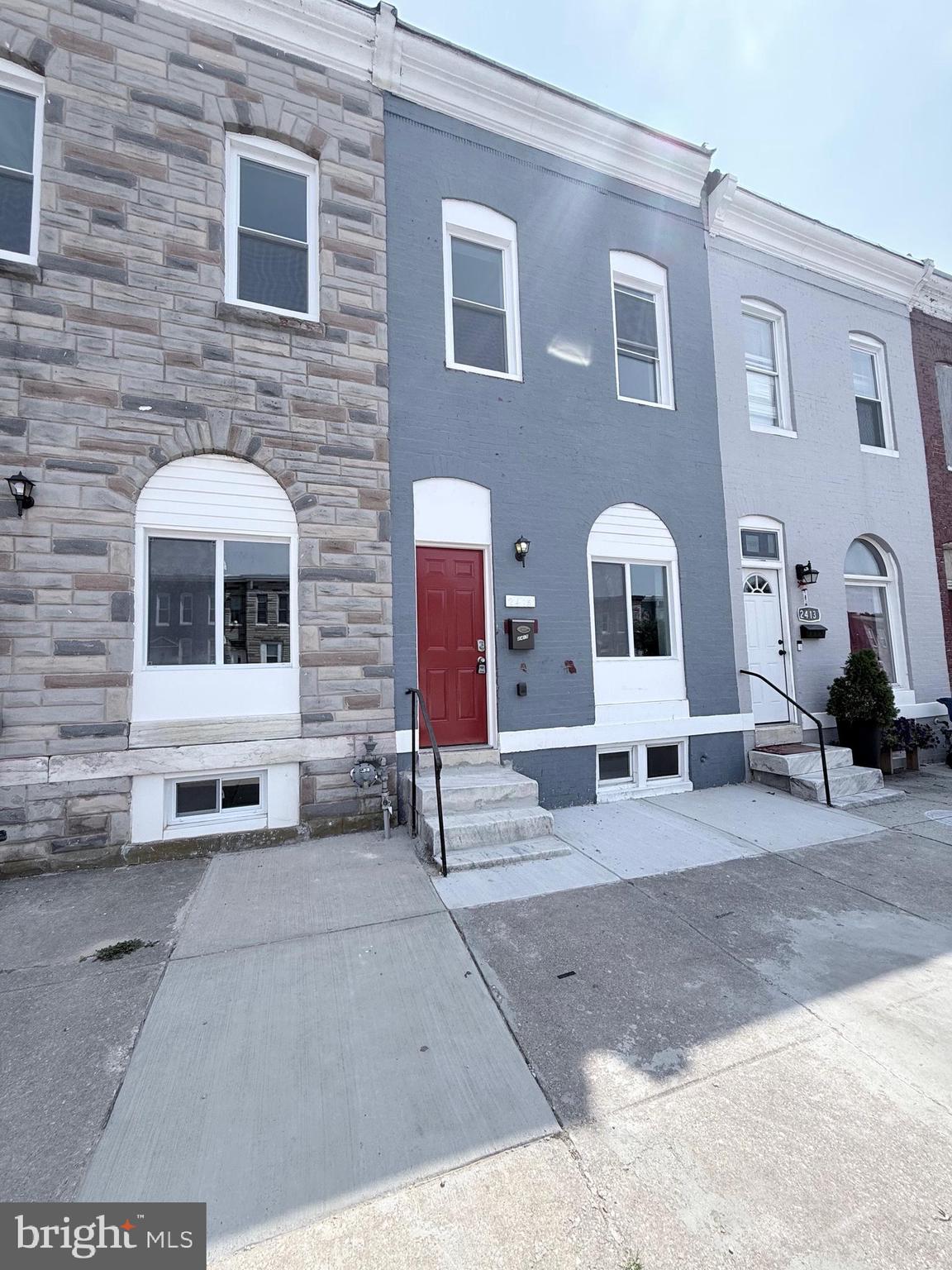 2415 Federal Street Baltimore, MD 21213 - Photo 1 of 35 a front view of a house with a sitting area