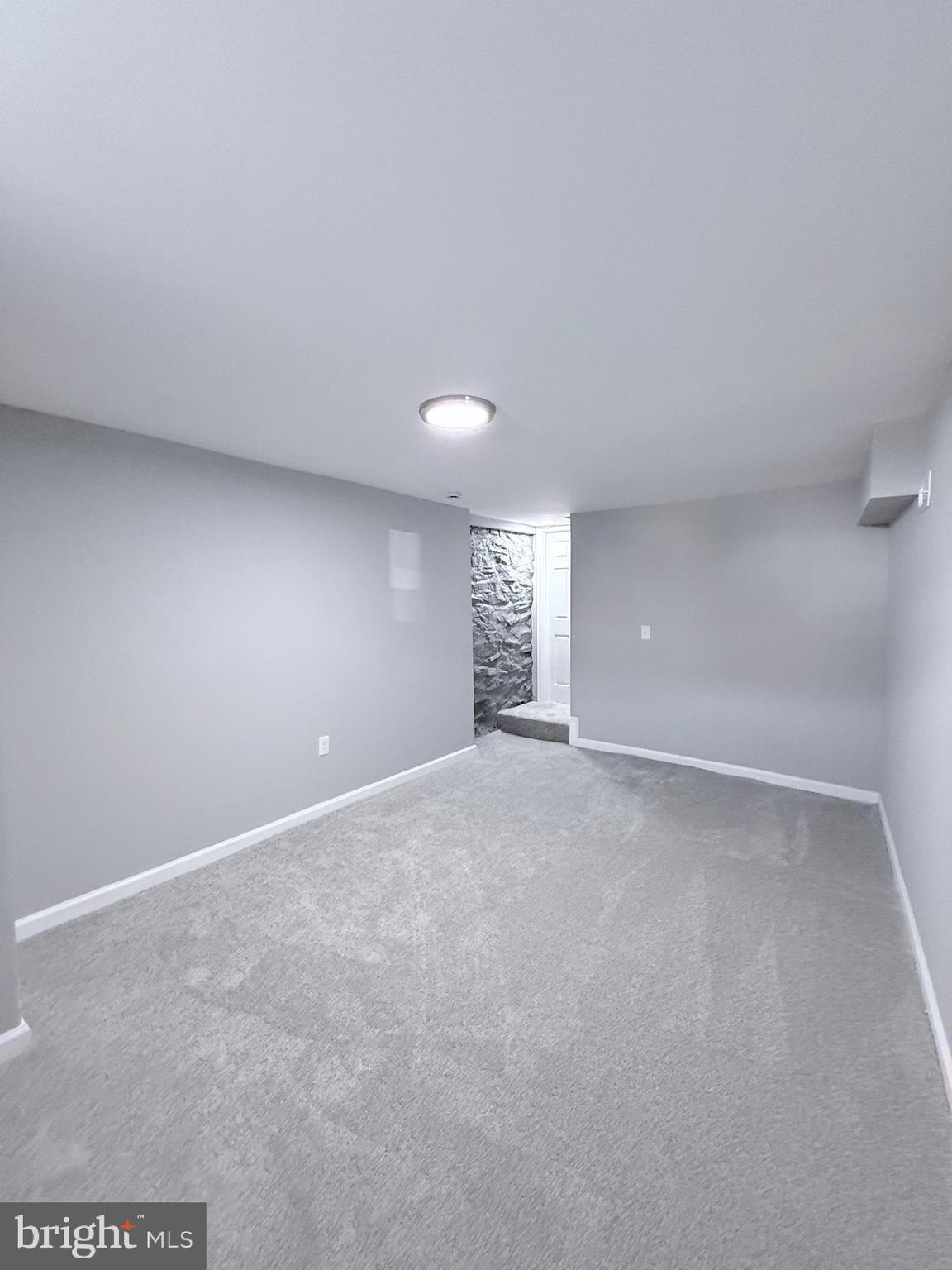 2415 Federal Street Baltimore, MD 21213 - Photo 21 of 35 a view of an empty room with a window