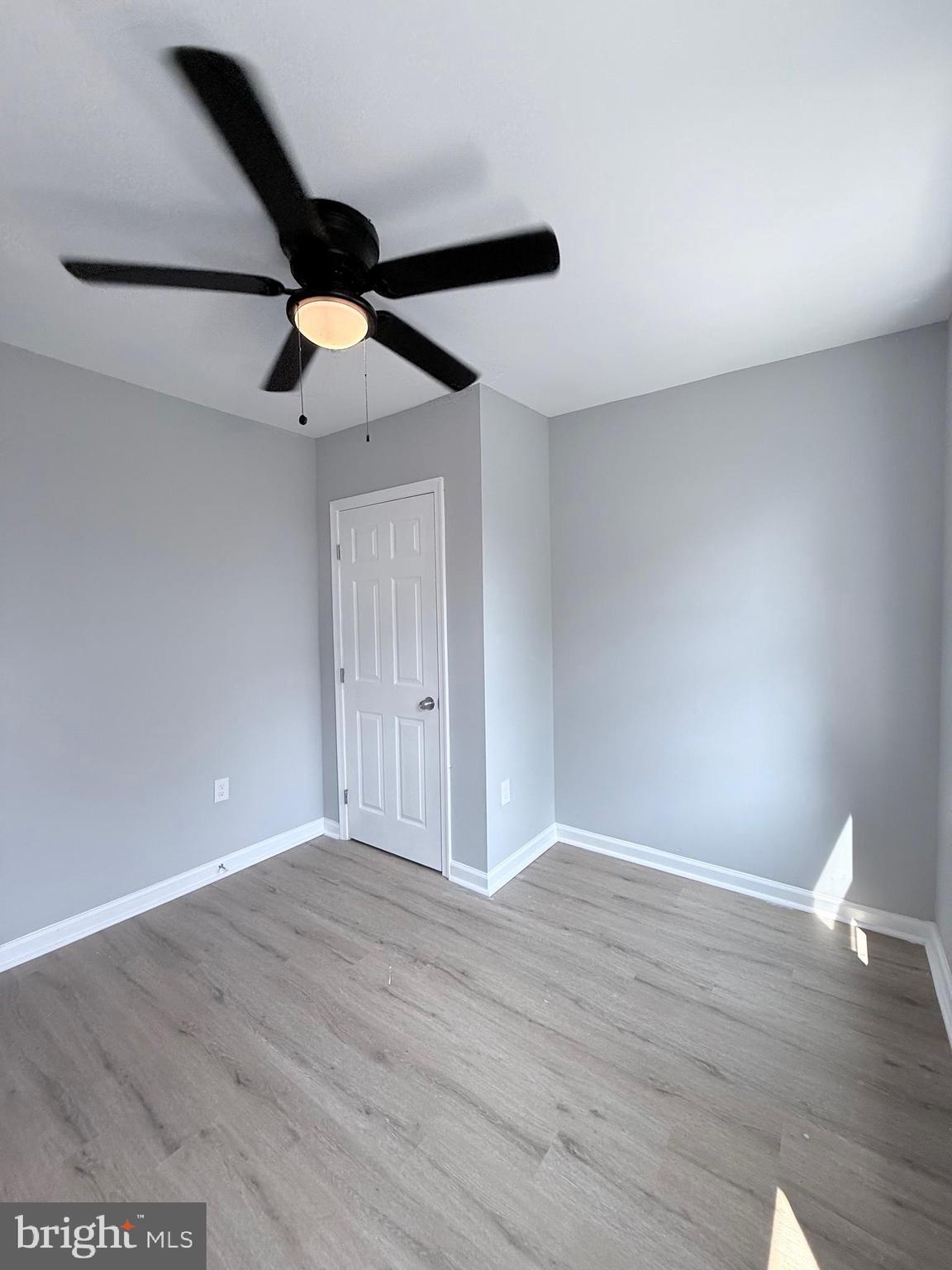 2415 Federal Street Baltimore, MD 21213 - Photo 33 of 35 a view of an empty room with wooden floor