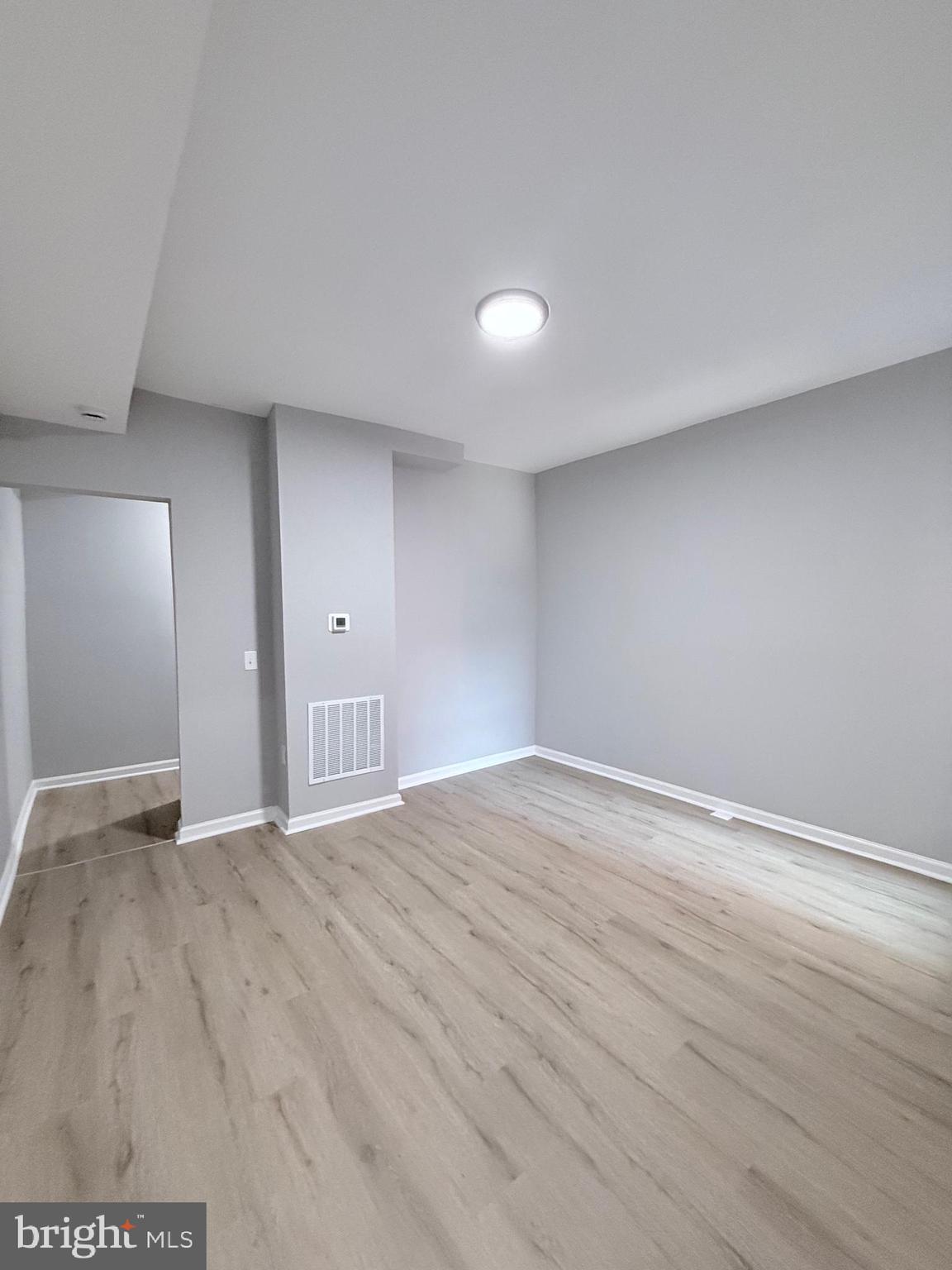 2415 Federal Street Baltimore, MD 21213 - Photo 10 of 35 a view of an empty room with wooden floor