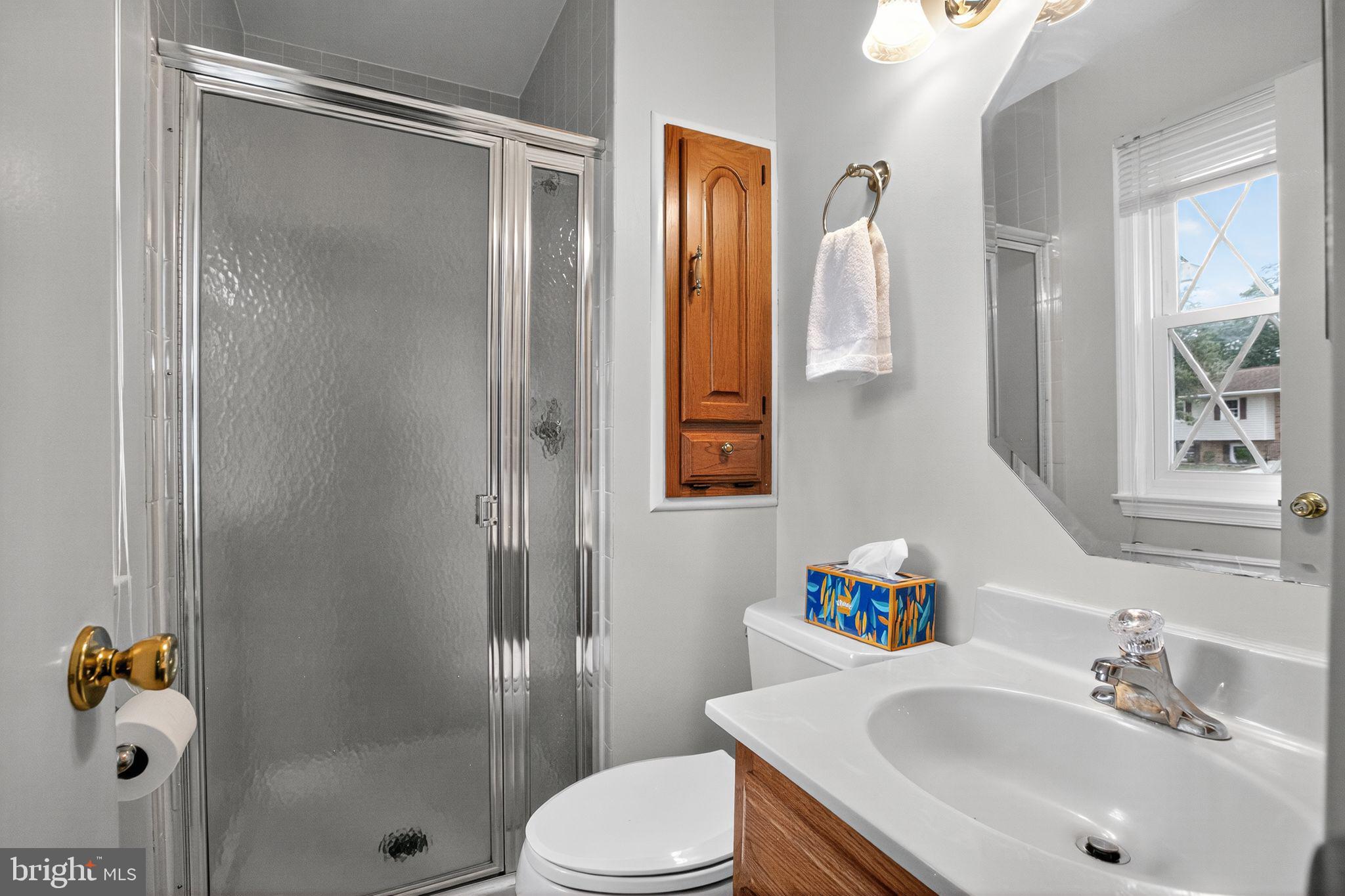 7374 Roxbury Avenue Manassas, VA 20109 - Photo 11 of 42 a bathroom with a sink toilet and shower