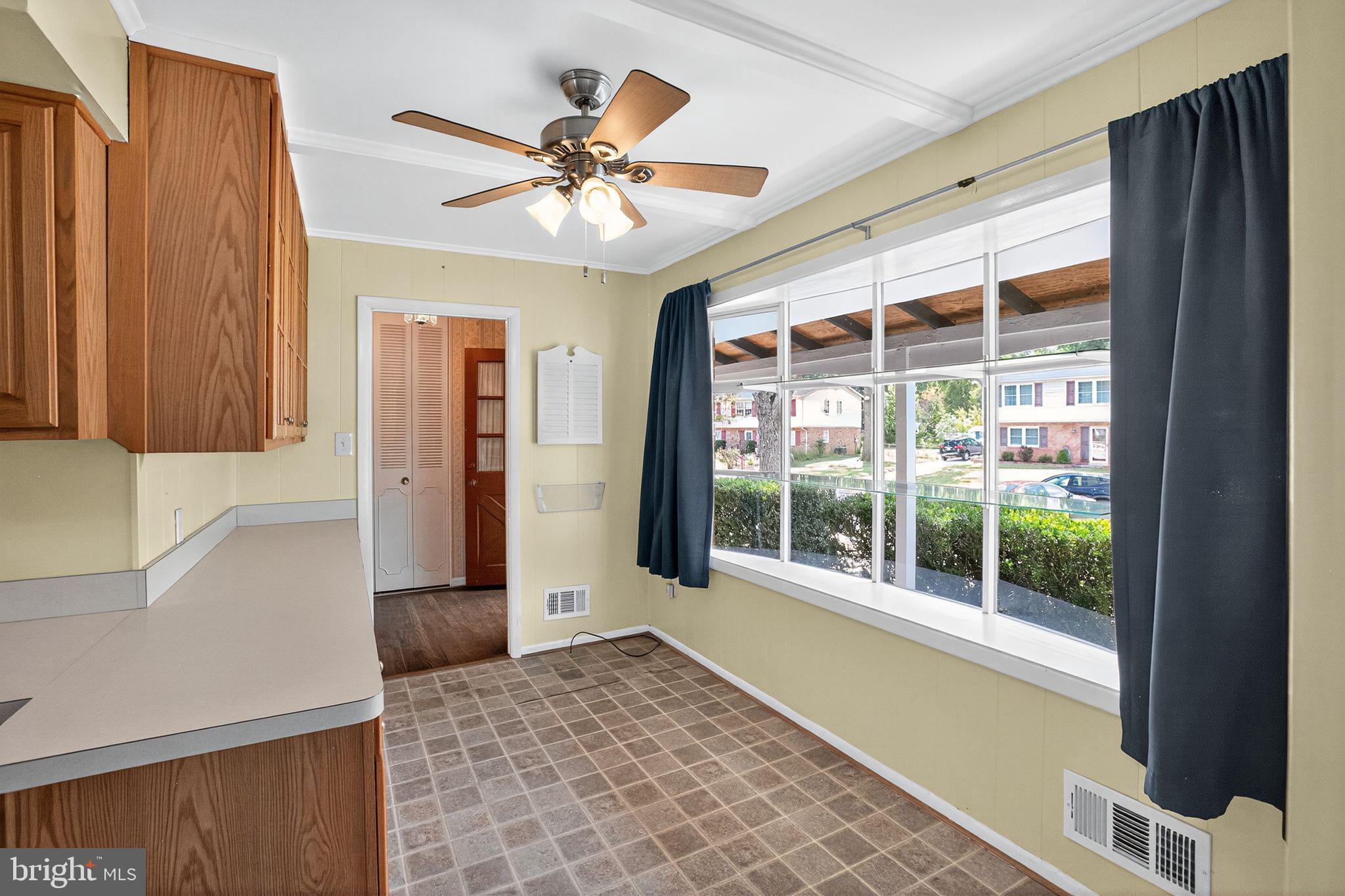 7374 Roxbury Avenue Manassas, VA 20109 - Photo 17 of 42 a view of a livingroom with a ceiling fan and window