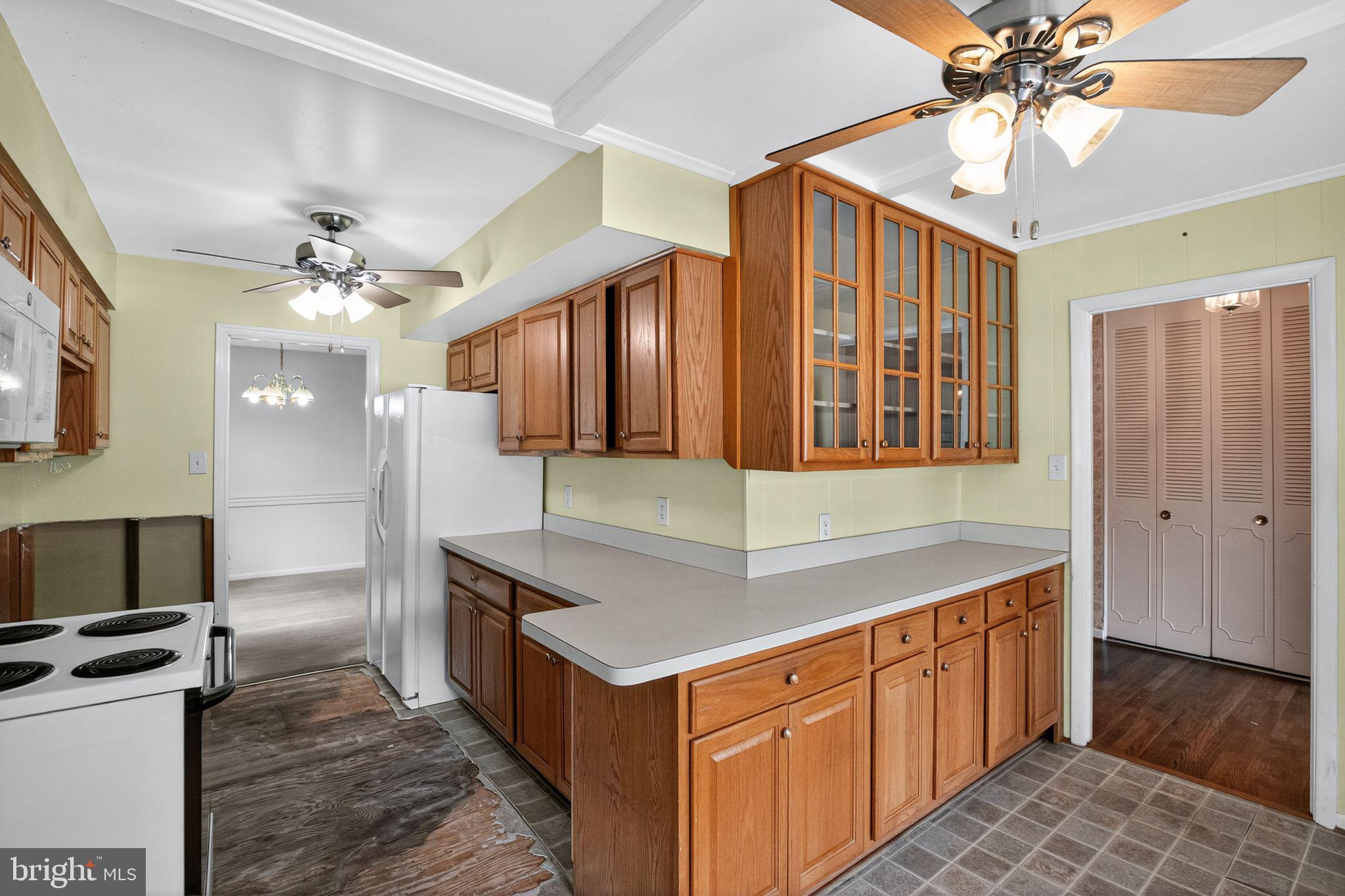 7374 Roxbury Avenue Manassas, VA 20109 - Photo 20 of 42 a kitchen with granite countertop a sink cabinets stainless steel appliances and a chandelier