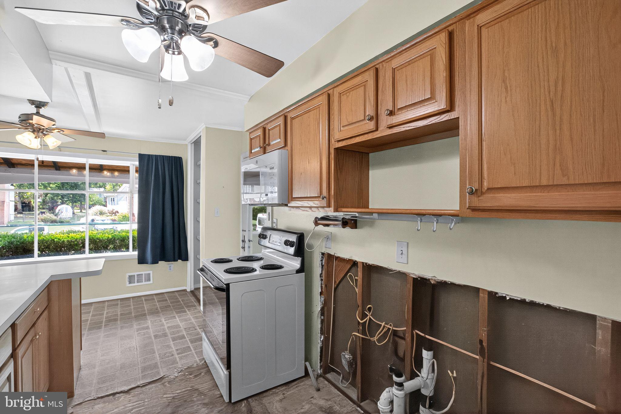 7374 Roxbury Avenue Manassas, VA 20109 - Photo 21 of 42 a kitchen with stainless steel appliances granite countertop a cabinets and a stove