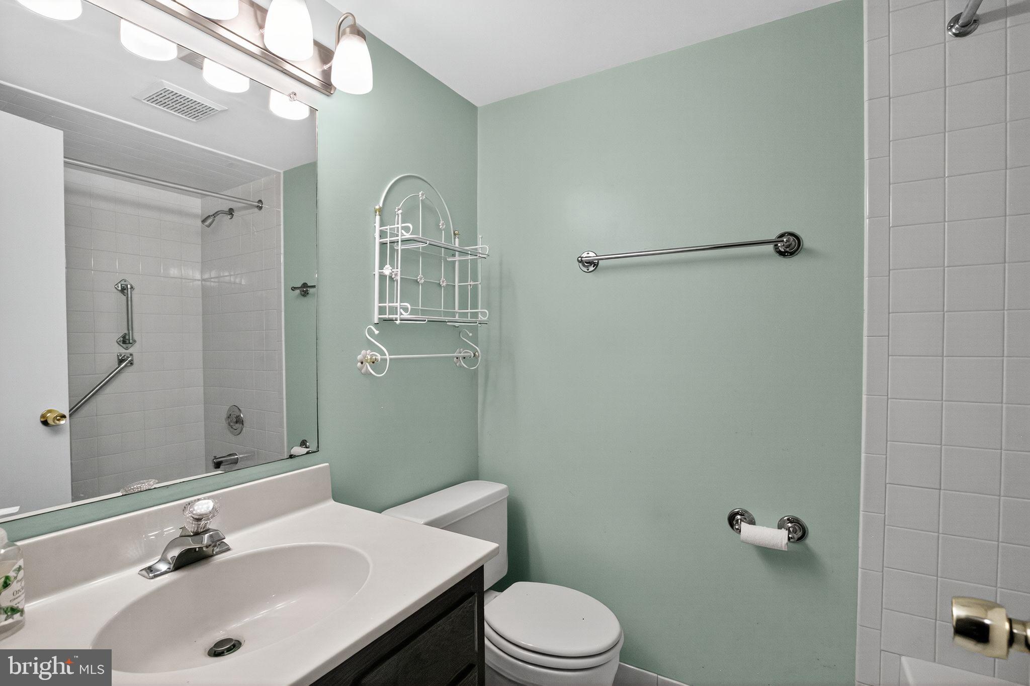 7374 Roxbury Avenue Manassas, VA 20109 - Photo 30 of 42 a bathroom with a sink a toilet and shower