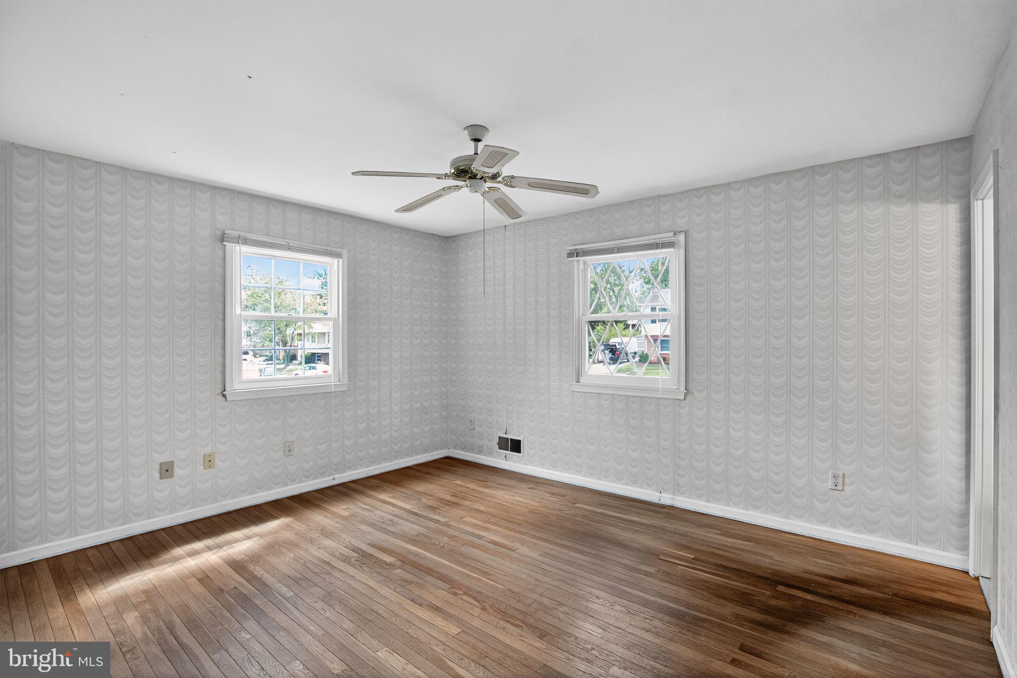 7374 Roxbury Avenue Manassas, VA 20109 - Photo 9 of 42 a view of an empty room with wooden floor and a window