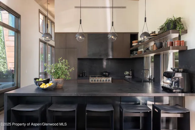 a kitchen with a table and chairs in it