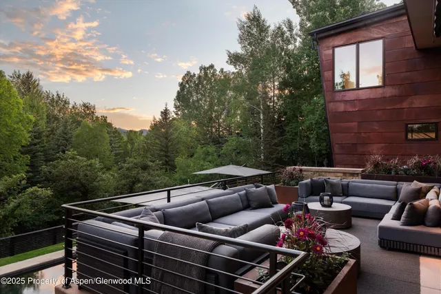 a outdoor living space with furniture and city view