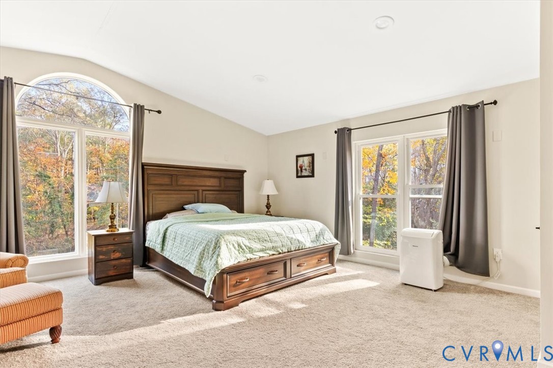 517 West Riverside Drive Lanexa, VA 23089 - Photo 17 of 31 a spacious bedroom with a bed and a large window